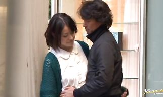 Elegant asian Kaede Niiyama is kneeling in front of pussy tester and gently sucking his hard pipe